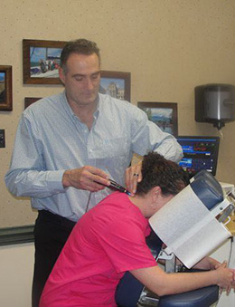 Dr. Nashman works with a patient using the ProAdjuster™